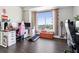 Bright bedroom with hardwood floors, large windows offering a city view, and modern work space at 285 Centennial Olympic Park Nw Dr # 904, Atlanta, GA 30313
