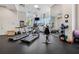 Modern gym equipped with treadmills, stationary bikes, weights, and fitness accessories at 285 Centennial Olympic Park Nw Dr # 904, Atlanta, GA 30313