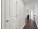 Hallway with hardwood floors, leading to rooms with white doors at 285 Centennial Olympic Park Nw Dr # 904, Atlanta, GA 30313