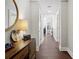Inviting entryway with dark hardwood floors, stylish decor, and neutral paint and modern light fixtures at 285 Centennial Olympic Park Nw Dr # 904, Atlanta, GA 30313