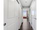 Hallway with white doors, hardwood floors and a window at the end at 285 Centennial Olympic Park Nw Dr # 904, Atlanta, GA 30313