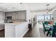 Open-concept kitchen with modern appliances, gray cabinetry, white quartz countertops, with views to the living room at 285 Centennial Olympic Park Nw Dr # 904, Atlanta, GA 30313