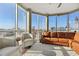 Spacious living room with floor to ceiling windows showcasing city views and stylish furniture and hardwood floors at 285 Centennial Olympic Park Nw Dr # 904, Atlanta, GA 30313