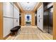Elegant hallway featuring stainless steel elevators, modern lighting, and tiled floors at 285 Centennial Olympic Park Nw Dr # 904, Atlanta, GA 30313