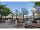 Beautiful outdoor patio featuring wood furniture, umbrellas, string lights, and city views at 285 Centennial Olympic Park Nw Dr # 904, Atlanta, GA 30313
