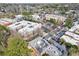 Aerial view of complex surrounded by mature trees, revealing the property's setting and ample parking at 560 Dutch Valley Ne Rd # 2207, Atlanta, GA 30324