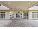 Inviting building entrance featuring a covered drop-off area and numerous entrance doors for easy access at 560 Dutch Valley Ne Rd # 2207, Atlanta, GA 30324