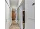 Hallway with hardwood floors, white walls, glass doors and utility closets at 560 Dutch Valley Ne Rd # 2207, Atlanta, GA 30324