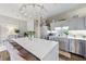 Elegant kitchen with a marble countertop island, stainless steel appliances, and modern cabinetry at 560 Dutch Valley Ne Rd # 2207, Atlanta, GA 30324
