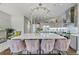 Stylish kitchen featuring a large marble island, pendant lighting, stainless steel appliances, and gray cabinetry at 560 Dutch Valley Ne Rd # 2207, Atlanta, GA 30324