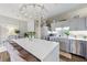 Bright, well-designed kitchen featuring stainless steel appliances, marble island, and bar stool seating at 560 Dutch Valley Ne Rd # 2207, Atlanta, GA 30324