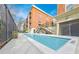 Stunning view of an outdoor pool, complemented by brick buildings and access stairs, perfect for relaxing at 560 Dutch Valley Ne Rd # 2207, Atlanta, GA 30324