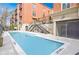 Inviting outdoor pool with clear blue water, surrounded by a deck and nearby stairwell access at 560 Dutch Valley Ne Rd # 2207, Atlanta, GA 30324