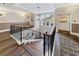 Elegant staircase with wood treads, black iron spindles, and natural light in a well-appointed building at 560 Dutch Valley Ne Rd # 2207, Atlanta, GA 30324