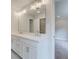 Bright bathroom boasts double vanity, large mirror, and stylish lighting at 179 Bluffington Way, Marietta, GA 30066