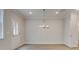 Bright dining room with hardwood floors, neutral walls, and modern chandelier at 179 Bluffington Way, Marietta, GA 30066