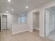 Spacious hallway with hardwood flooring, white walls, and recessed lighting leads to other rooms at 179 Bluffington Way, Marietta, GA 30066