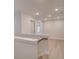 Bright hallway with hardwood flooring and a staircase leading up to additional rooms at 179 Bluffington Way, Marietta, GA 30066