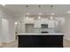 Beautiful kitchen with white cabinets, center island and stainless steel microwave at 179 Bluffington Way, Marietta, GA 30066