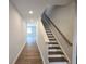 Bright entryway featuring wood-look floors, a staircase, and neutral paint at 2694 Mourning Dove Drive (Lot 35), Grayson, GA 30017