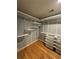 Custom walk-in closet with shelving and storage bins at 3491 Roswell Ne Rd # D, Atlanta, GA 30305