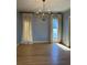 Dining room featuring hardwood floors, a decorative chandelier, and lots of light at 3491 Roswell Ne Rd # D, Atlanta, GA 30305