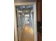 Long hallway with hardwood floors and neutral wall colors, creating a bright and inviting atmosphere at 3491 Roswell Ne Rd # D, Atlanta, GA 30305