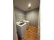 Clean laundry room features hardwood floors, shelving and modern washer and dryer units at 3491 Roswell Ne Rd # D, Atlanta, GA 30305