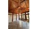 This sunroom features wood ceilings, tiled floors, lots of windows, and a decorative chandelier at 3491 Roswell Ne Rd # D, Atlanta, GA 30305