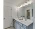 Bathroom features a double sink vanity with contemporary lighting and hardware at 674 Allier Ter, Cumming, GA 30041