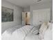 Bright bedroom featuring stylish gray walls and comfortable bedding, creating a serene and inviting atmosphere at 674 Allier Ter, Cumming, GA 30041