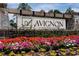 Elegant community entrance with colorful flowers and welcoming signage at 674 Allier Ter, Cumming, GA 30041