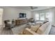 Bright and airy living room featuring modern furnishings and hardwood floors at 674 Allier Ter, Cumming, GA 30041