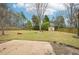 Spacious backyard with a patio, lush grass, shed, and privacy fence, perfect for outdoor activities at 1699 Boulder Walk Se Dr, Atlanta, GA 30316