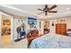 A cozy bedroom featuring a ceiling fan and television at 1699 Boulder Walk Se Dr, Atlanta, GA 30316