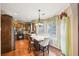 Kitchen dining area with natural light and hardwood flooring adjacent to kitchen at 1699 Boulder Walk Se Dr, Atlanta, GA 30316