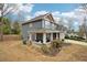 View of the side of a home with a covered porch and landscaping at 1699 Boulder Walk Se Dr, Atlanta, GA 30316