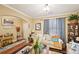 Cozy living room featuring hardwood floors, crown molding, and neutral paint at 1699 Boulder Walk Se Dr, Atlanta, GA 30316