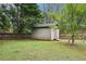 The backyard has a shed, lawn, and fencing that provides security and storage at 1699 Boulder Walk Se Dr, Atlanta, GA 30316