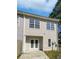 Two-story home featuring light siding, white-trimmed windows, and a walk out basement with double doors at 20 Pine Canyon Sw Dr # 15, Atlanta, GA 30331