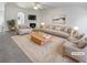 Bright living room with plush carpet, fireplace, and stylish furnishings at 20 Pine Canyon Sw Dr # 15, Atlanta, GA 30331