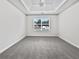 Bright bedroom with large window, tray ceiling, and neutral color palette at 1882 Byrom Pkwy, Jonesboro, GA 30236