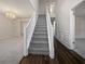 Welcoming foyer with a staircase and a view of an elegant chandelier at 1882 Byrom Pkwy, Jonesboro, GA 30236