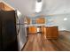 Functional kitchen featuring an island, black appliances, and wood cabinets at 1882 Byrom Pkwy, Jonesboro, GA 30236