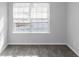 Bright bedroom with neutral paint, carpet, and natural light from window at 2025 Shawn Wayne Se Cir, Atlanta, GA 30316