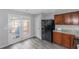 Modern kitchen boasts stainless steel appliances, lots of counter space, and easy access to the outdoor deck at 2025 Shawn Wayne Se Cir, Atlanta, GA 30316