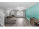 Spacious living room featuring gray walls, light vinyl floors, and ample natural light from large window at 2025 Shawn Wayne Se Cir, Atlanta, GA 30316