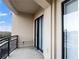 Balcony featuring black metal railings with views of the blue sky and trees in the neighborhood at 3445 Stratford Ne Rd # 1101, Atlanta, GA 30326