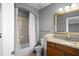 Bathroom features granite countertops, a mirror, and a shower-tub combo with white shower curtain at 3445 Stratford Ne Rd # 1101, Atlanta, GA 30326