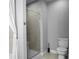 Bathroom featuring a glass-enclosed shower and neutral color scheme at 3445 Stratford Ne Rd # 1101, Atlanta, GA 30326
